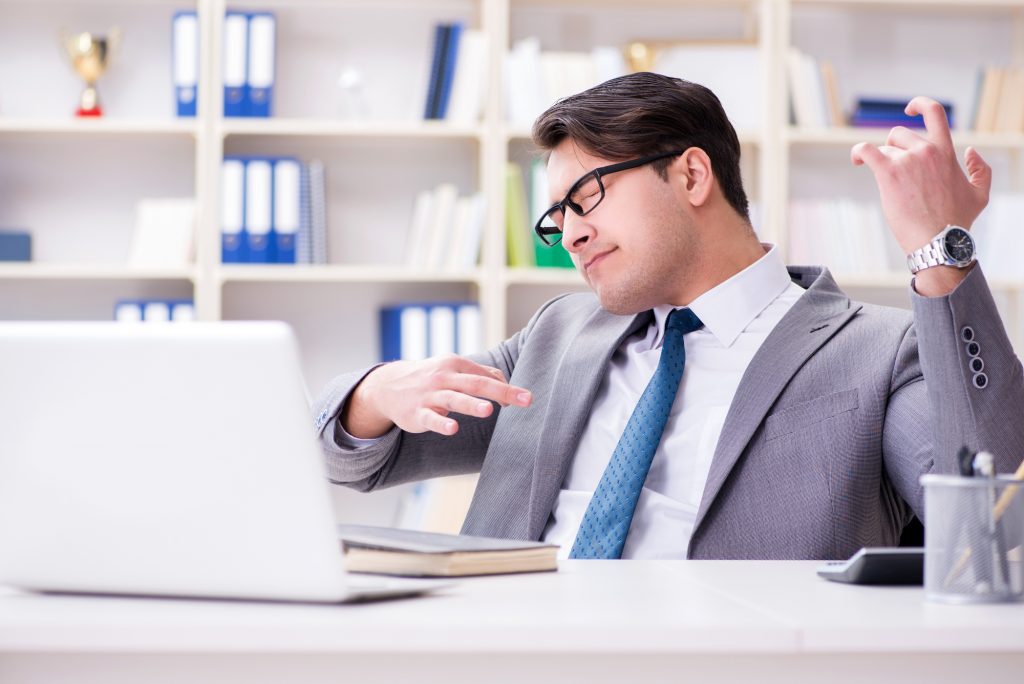 Businessman Playing Virtual Guitar In Office