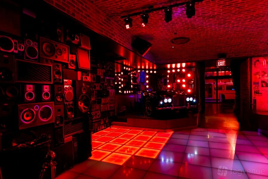 Christmas Disco: red-lit dance floor and booth seating at On The Record Nightclub and Speakeasy, Las Vegas