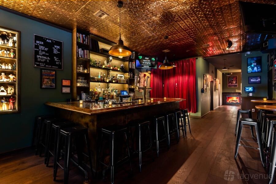 Carol-oke: red velvet curtain, warm lamps and a pressed-tin ceiling at AUX Karaoke Box, Brooklyn