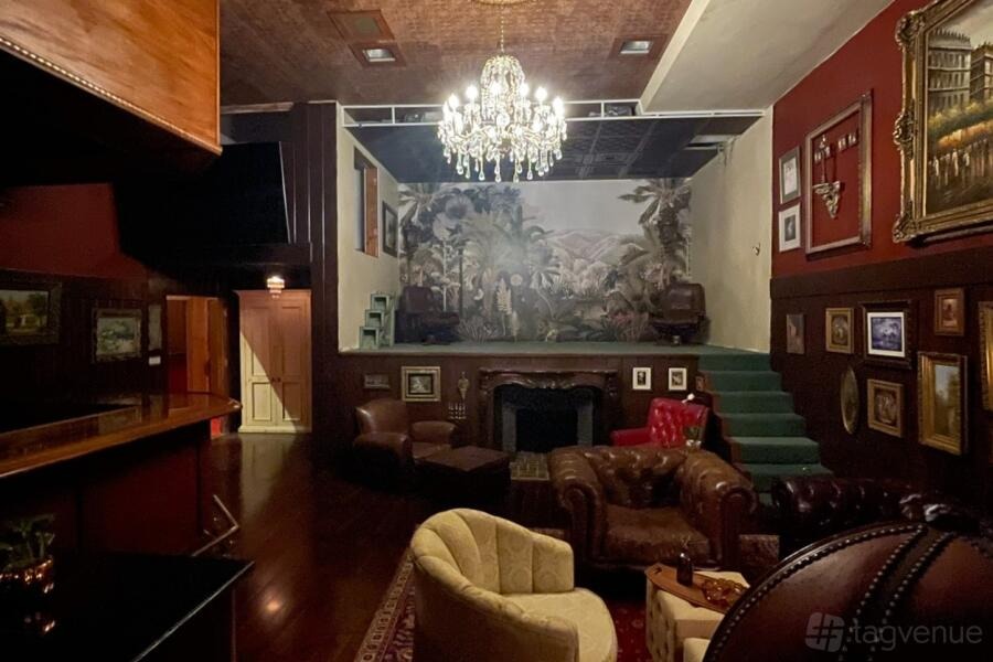Après-Ski Lodge: open fireplace, chandelier and deep red lounge seating at One On One Recording, Los Angeles
