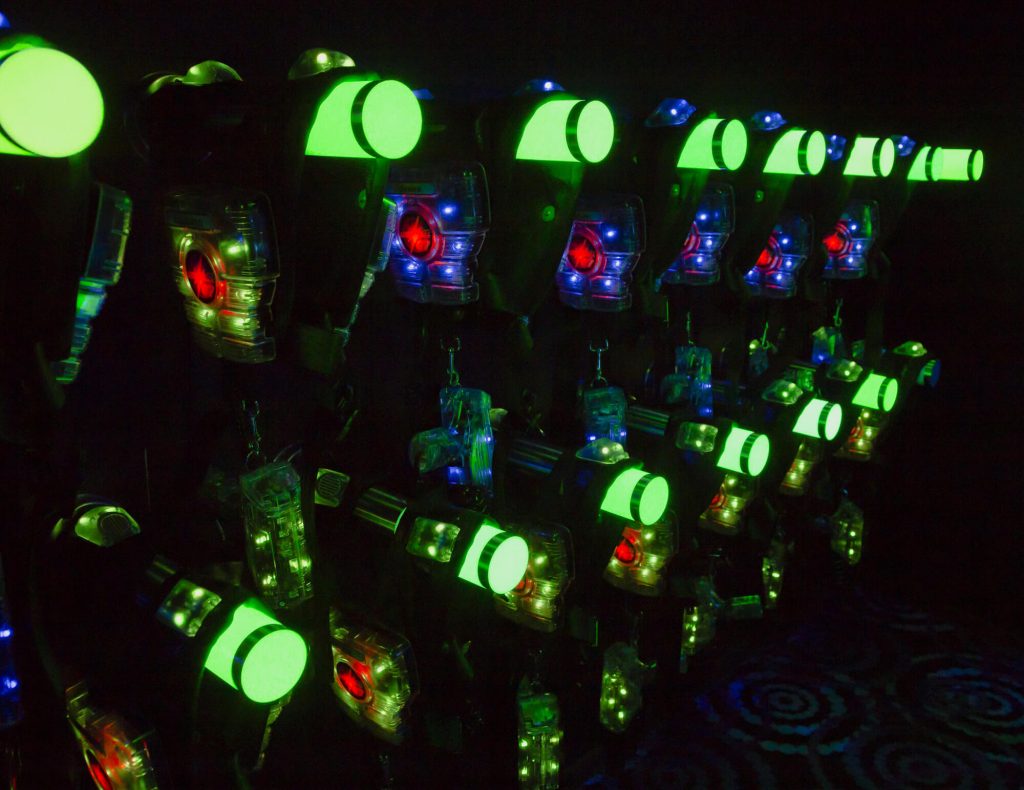 Game night with lights at an arcade. Company Outing Ideas to Help Your Team Bond