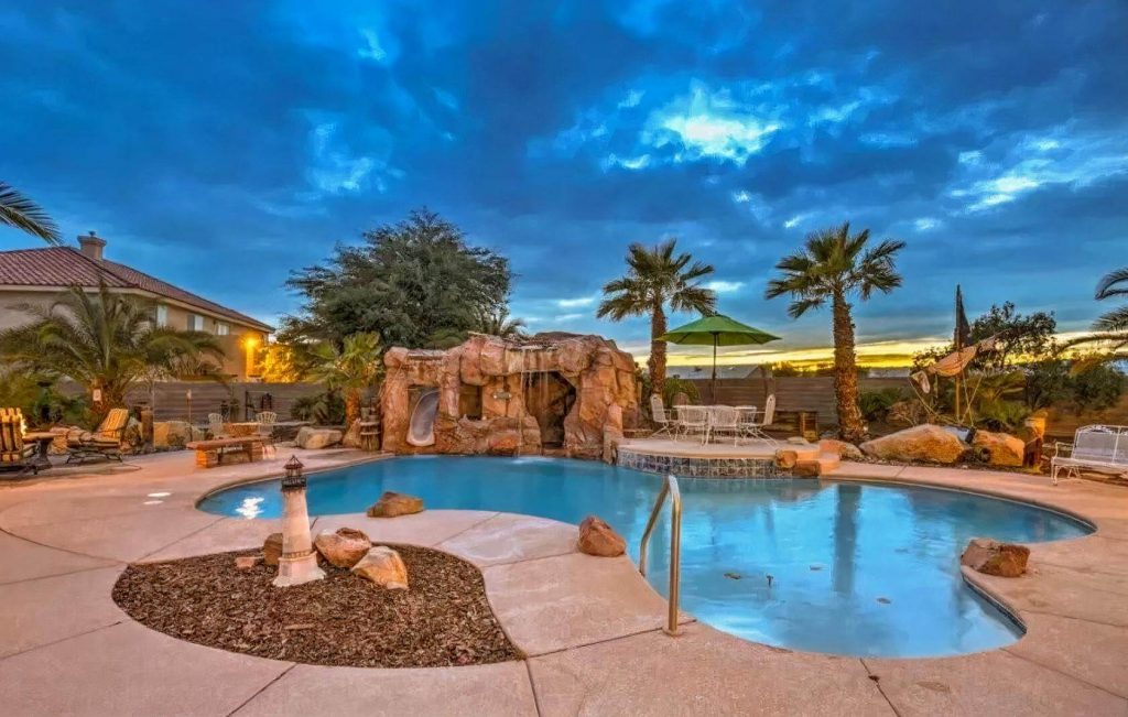 an oasis in Las Vegas, with a pool and palm trees
