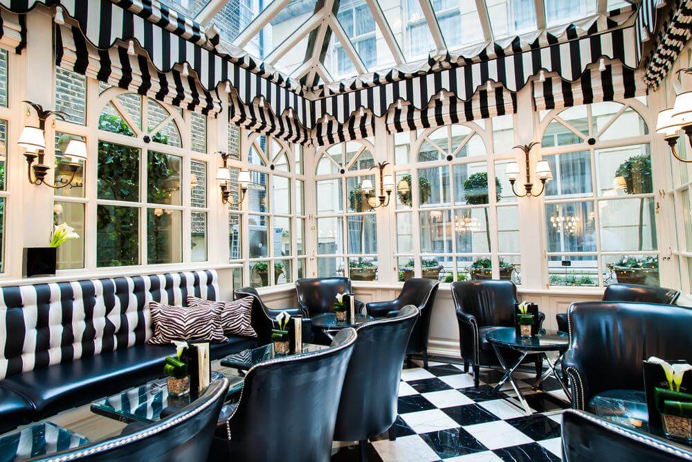 an elegant and upscale hotel conservatory in London