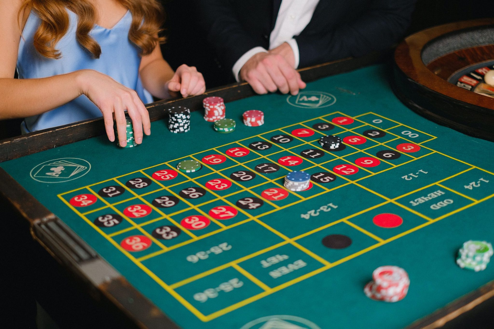 a lovely couple enjoying a game at their casino night engagement party