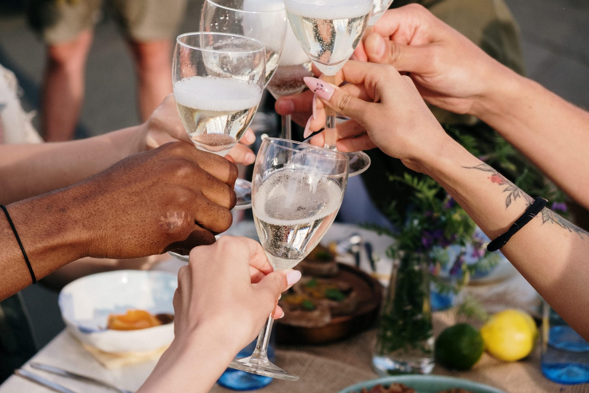 people making a toast at brunch