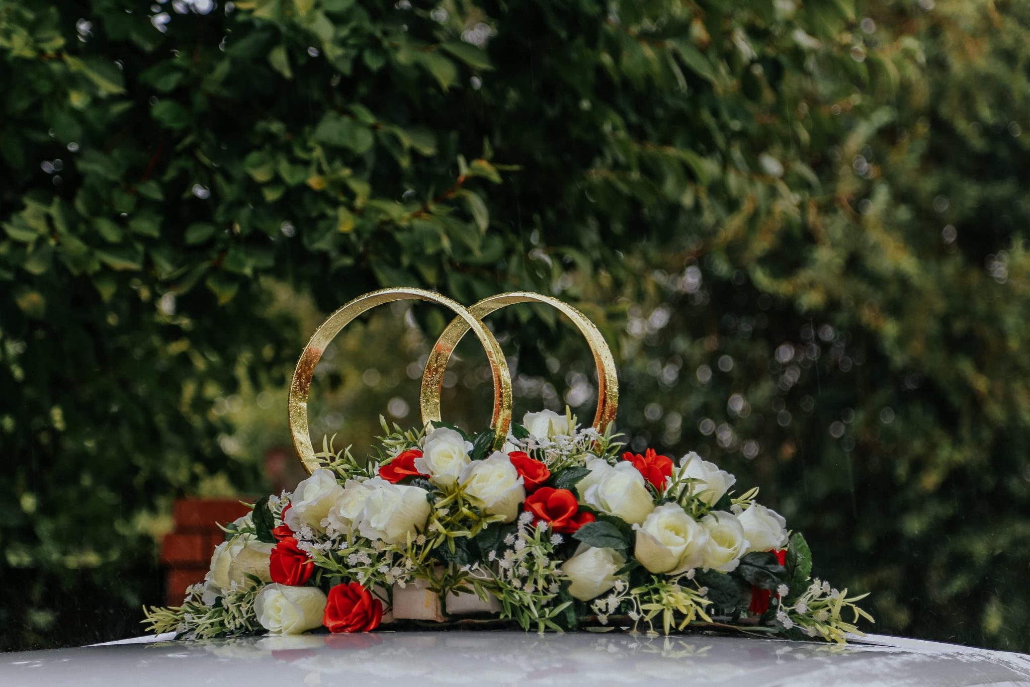 engagement party decoration consisting of two rings and flowers