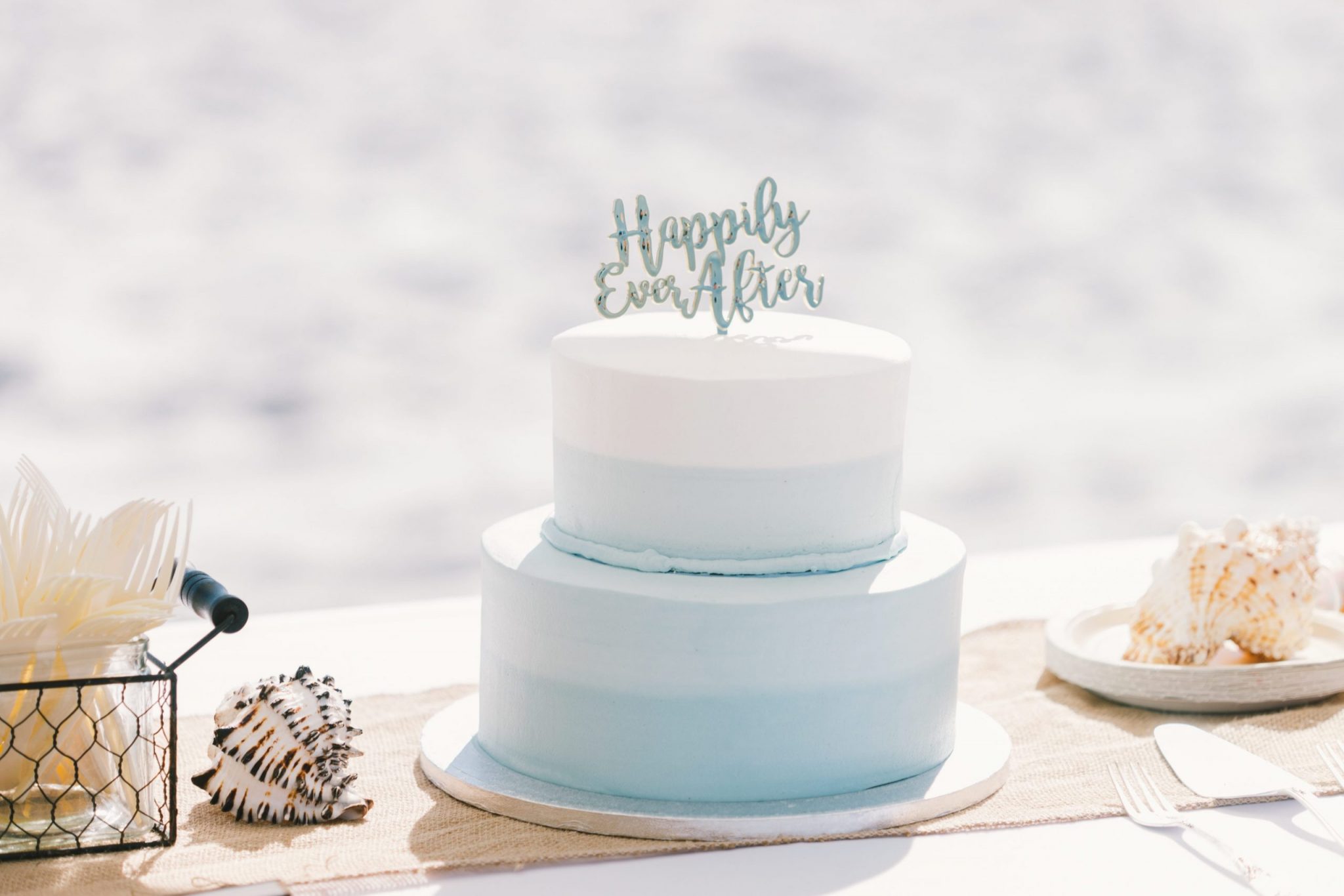 cake and decorations for a beach engagement party