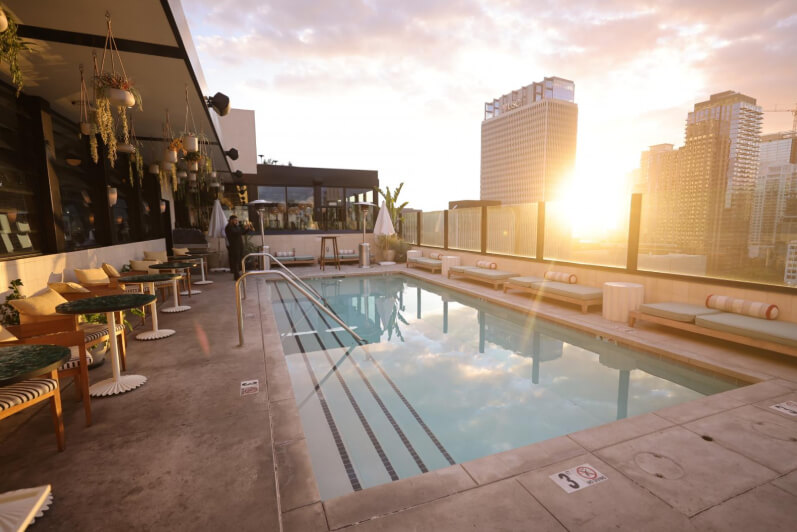 A terrace overlooking the city, with a pool in the centre. 