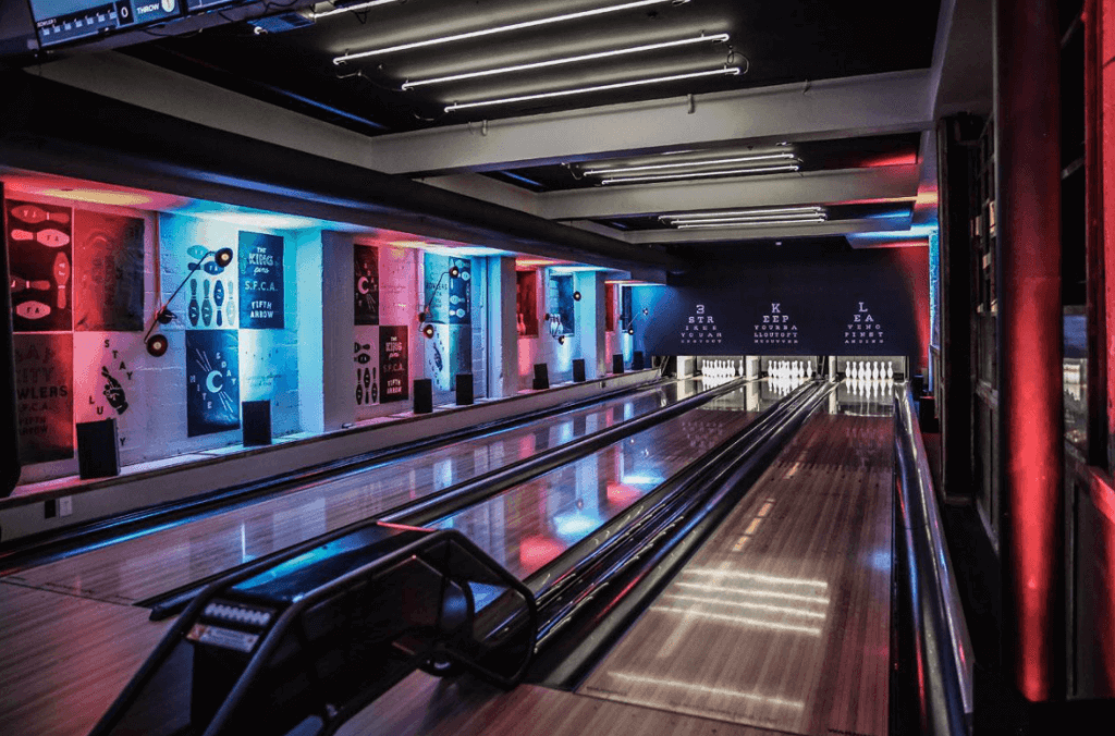 a colorfully-lit bowling alley