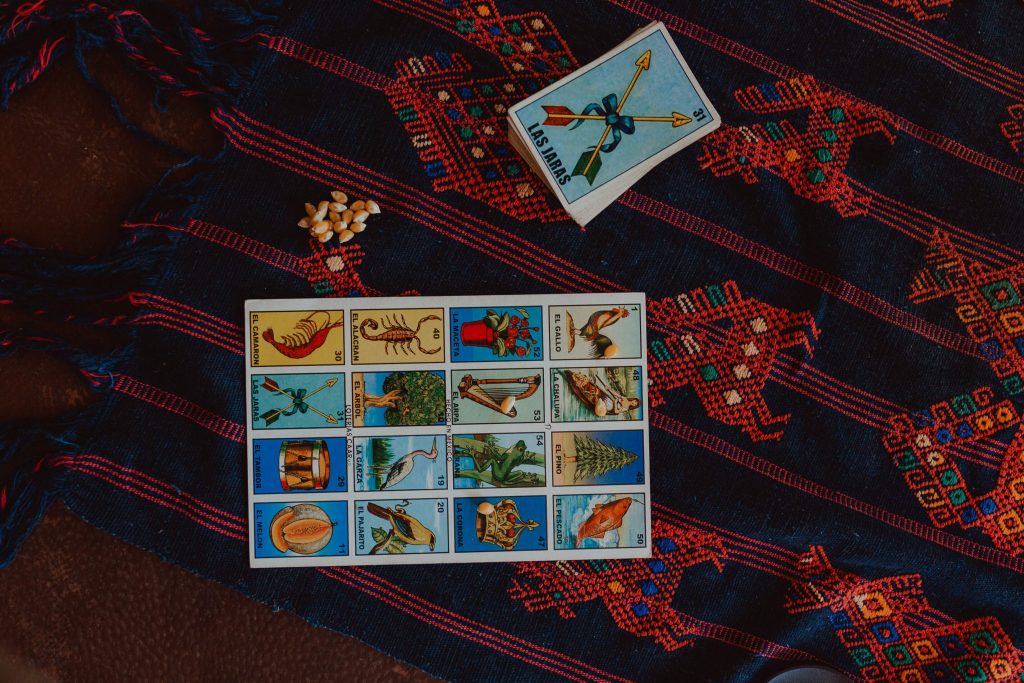 lotería cards on a colorful blanket