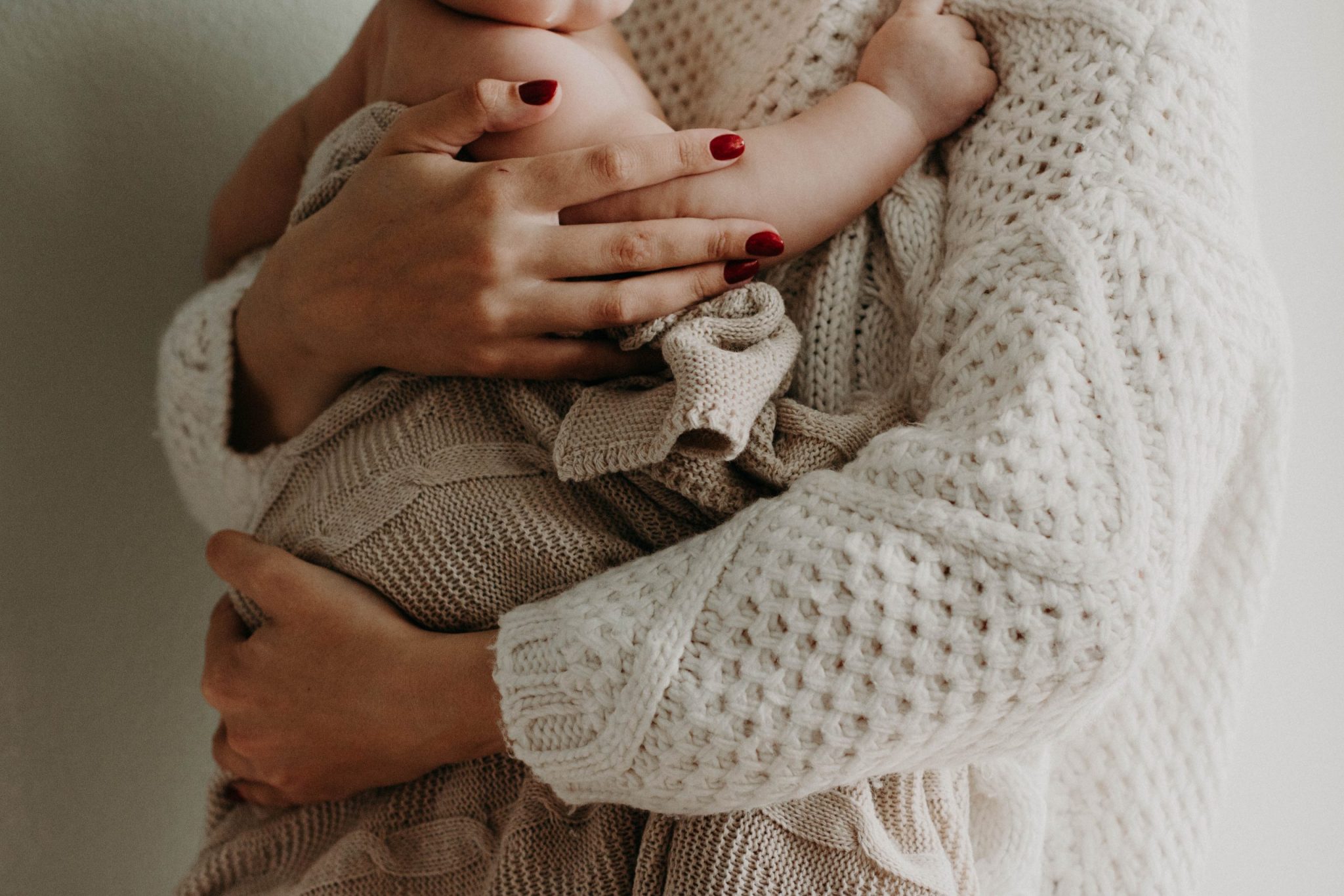 woman and baby in neutral clothing 