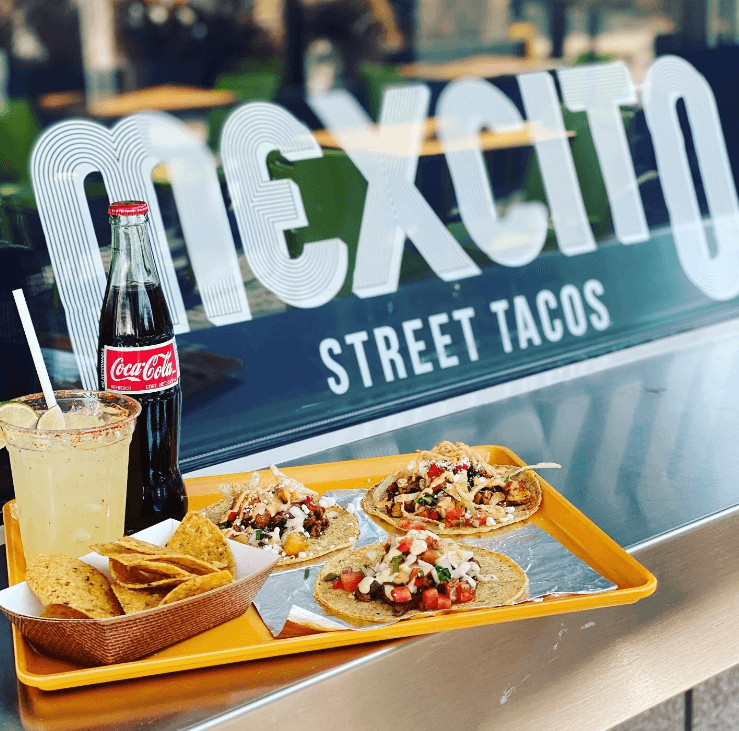 tacos served on a window sill of a restaurant