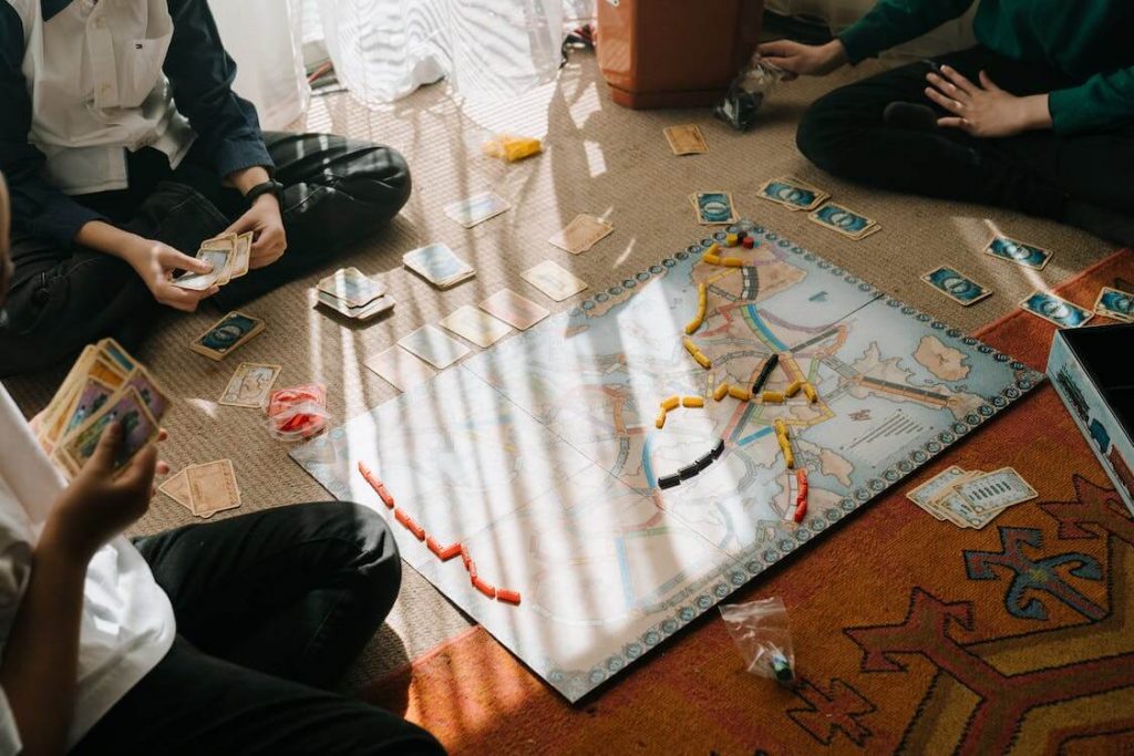 people playing a board game
