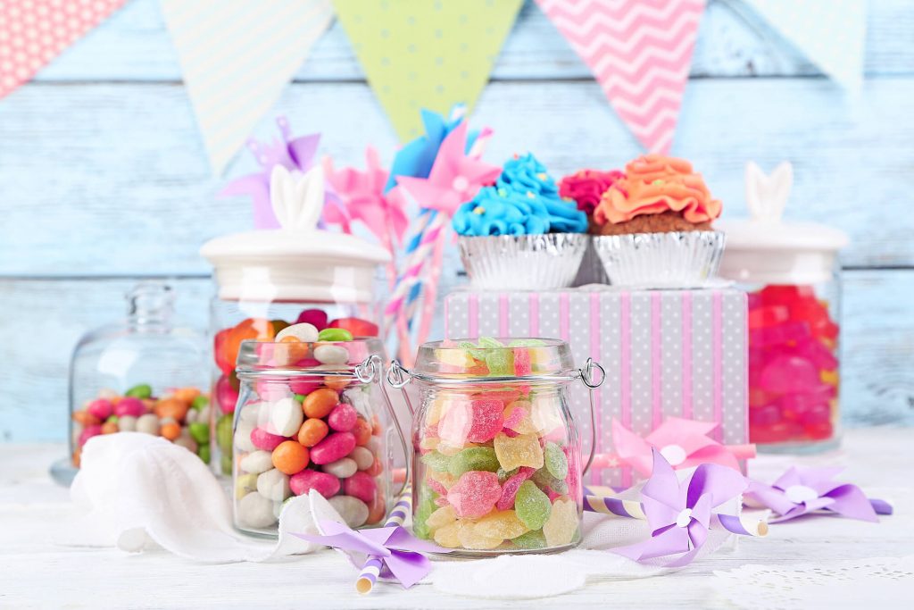 A buffet table with various types of colorful candy.