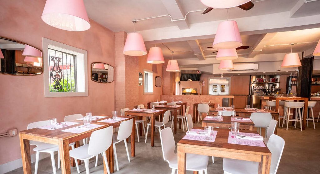 A pastel-pink-themed restaurant interior.
