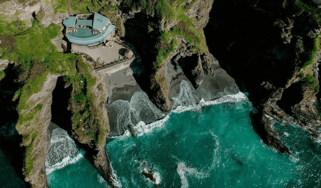 A venue hidden between rocks and mountains on a coast