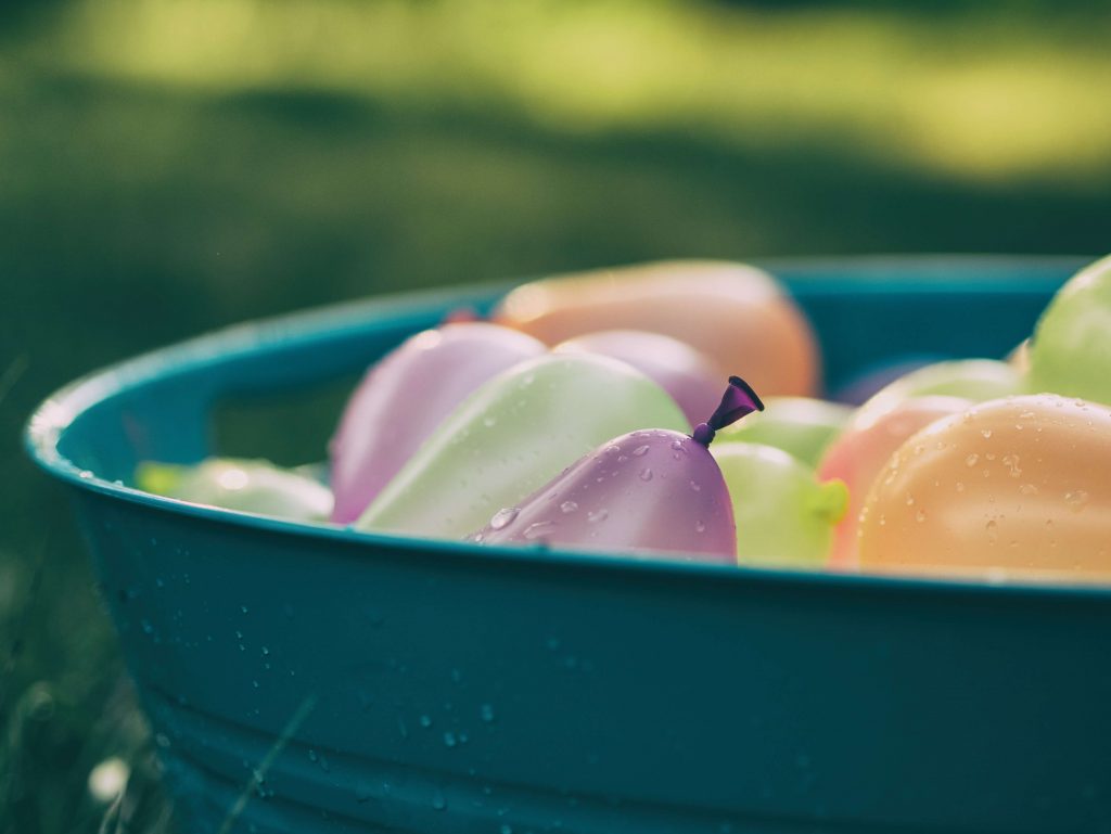 water-filled balloons in a tub