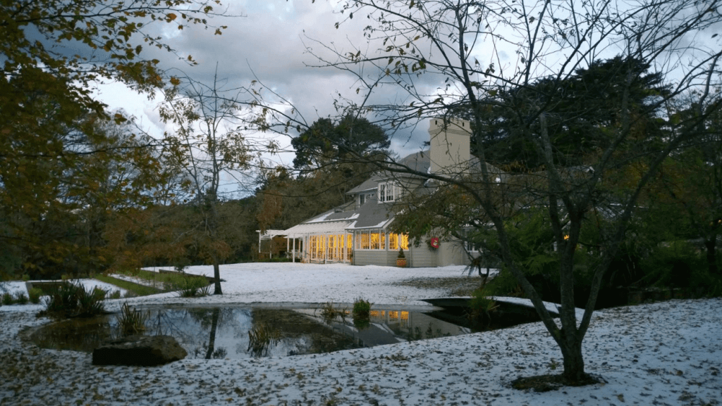 A country house lightly covered by snow