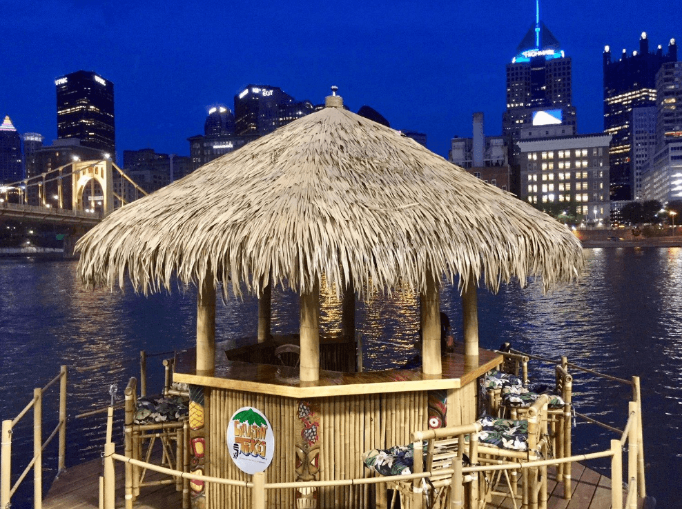 A tiki hut bar on the water
