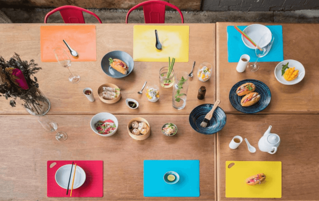 Colourfully set up table ready for a cooking class