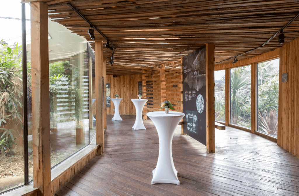 indoor room in a zoo with party tables set up