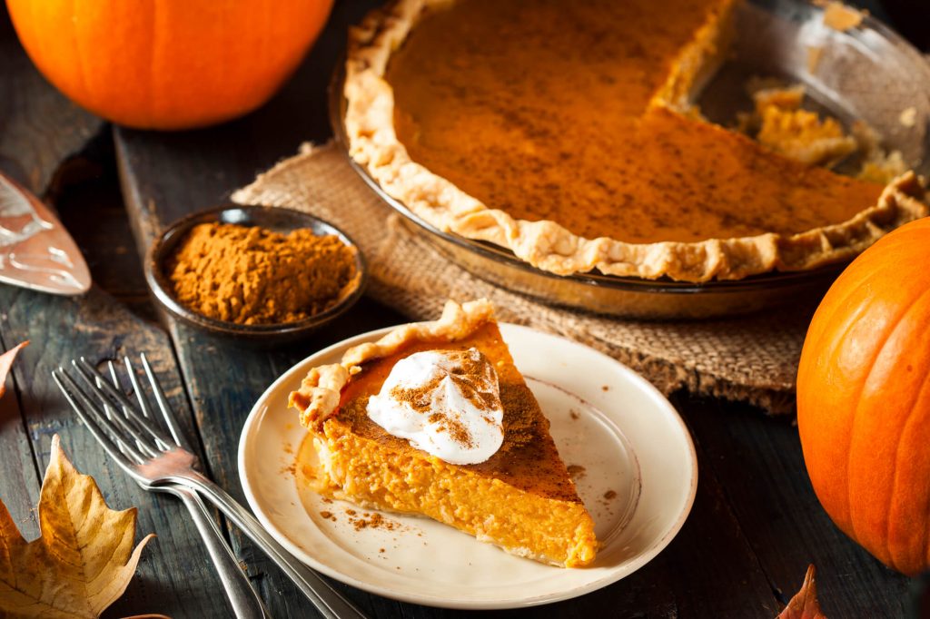 a slice of pumpkin pie on the table 