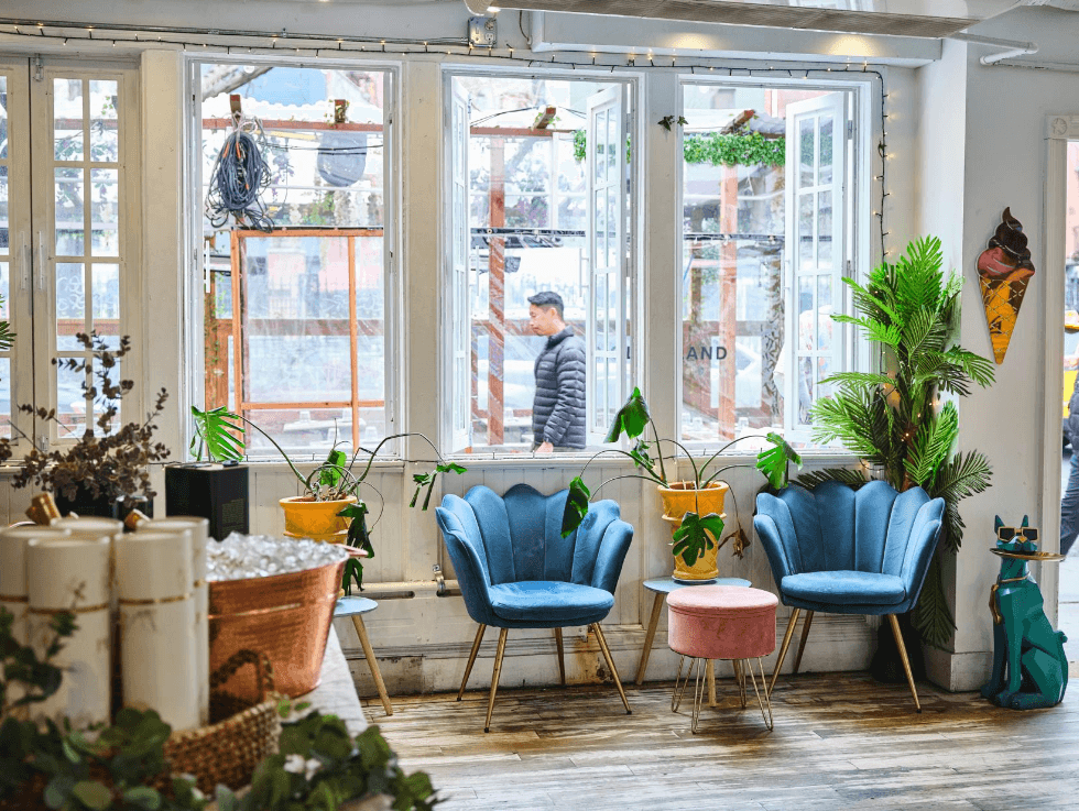 An elegant venue with soft chairs, overlooking a street