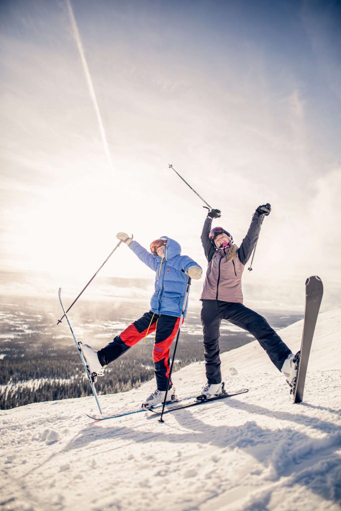 Ski trip idea for her birthday- two people having fun skiing