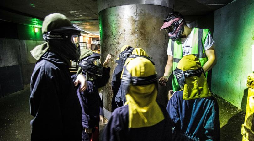 Goup of people dressed up for a laser tag game