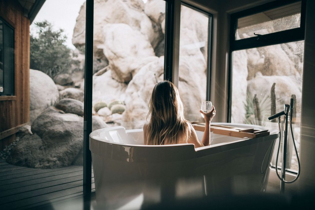 A woman enjoying the scenic view from a spa room