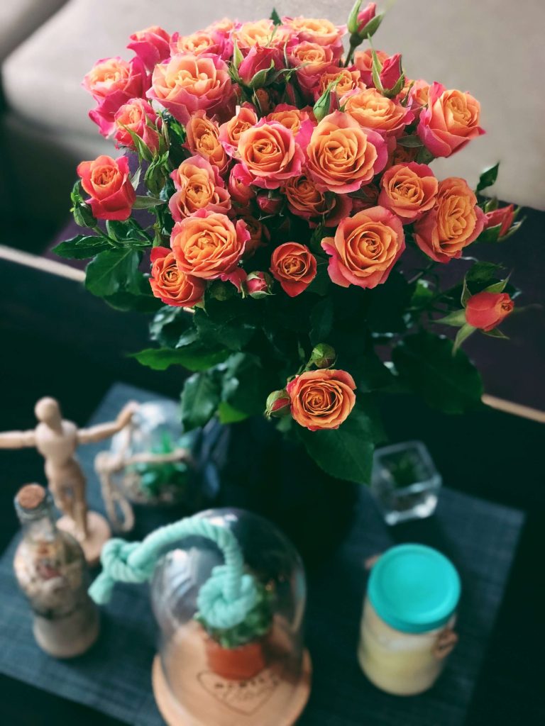 yellow and burgundy roses on a table- party decoration ideas