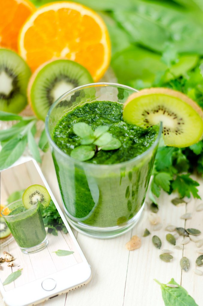a green smoothie on the table 