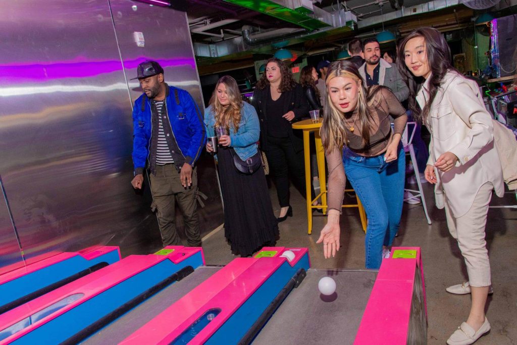 People playing games inside a venue