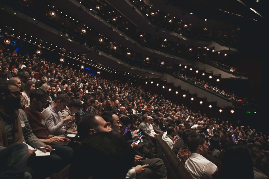 large audience hall filled with people