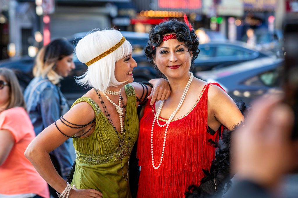 two women dressed up in flapper dresses