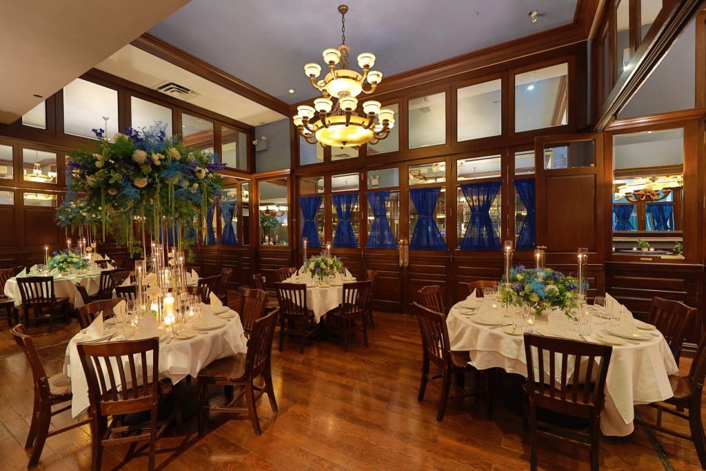 A stylish restaurant interior with elegant dining tables, ambient lighting, and sophisticated decor.