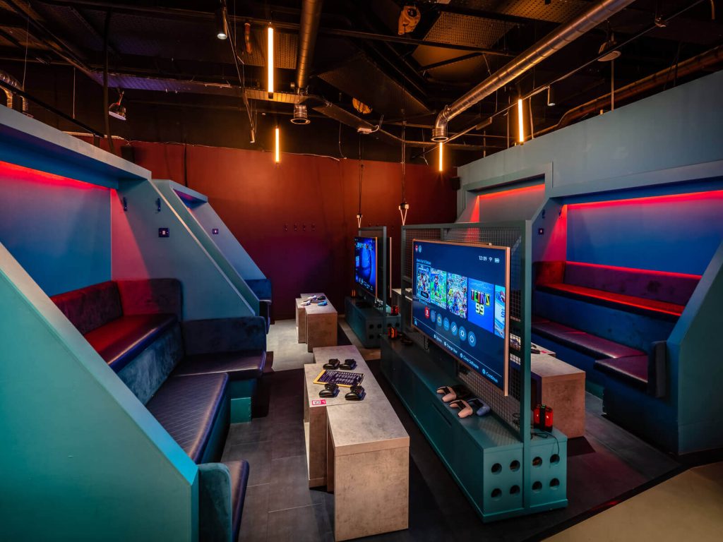 State-of-the-art gaming lounge with colorful seating for a unique birthday party idea for him in London.