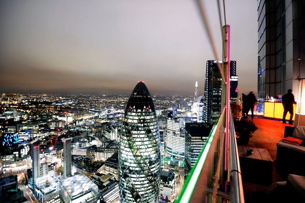 London cityscape view at night from a high-rise building, perfect for summer party ideas in London with an urban backdrop.