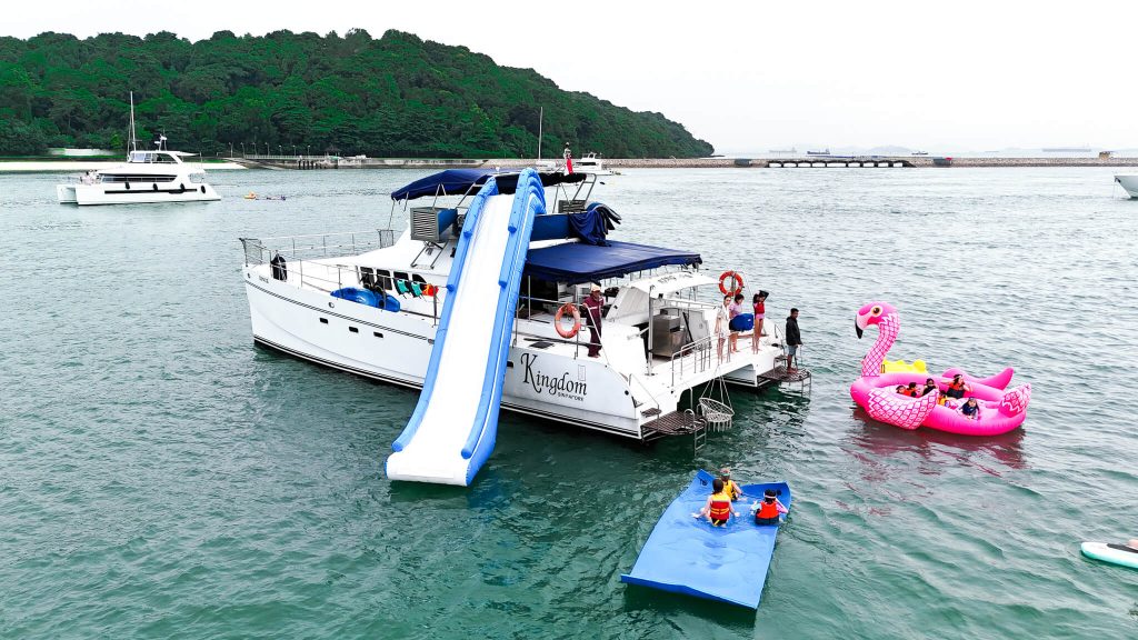 a catamaran with people partying on board