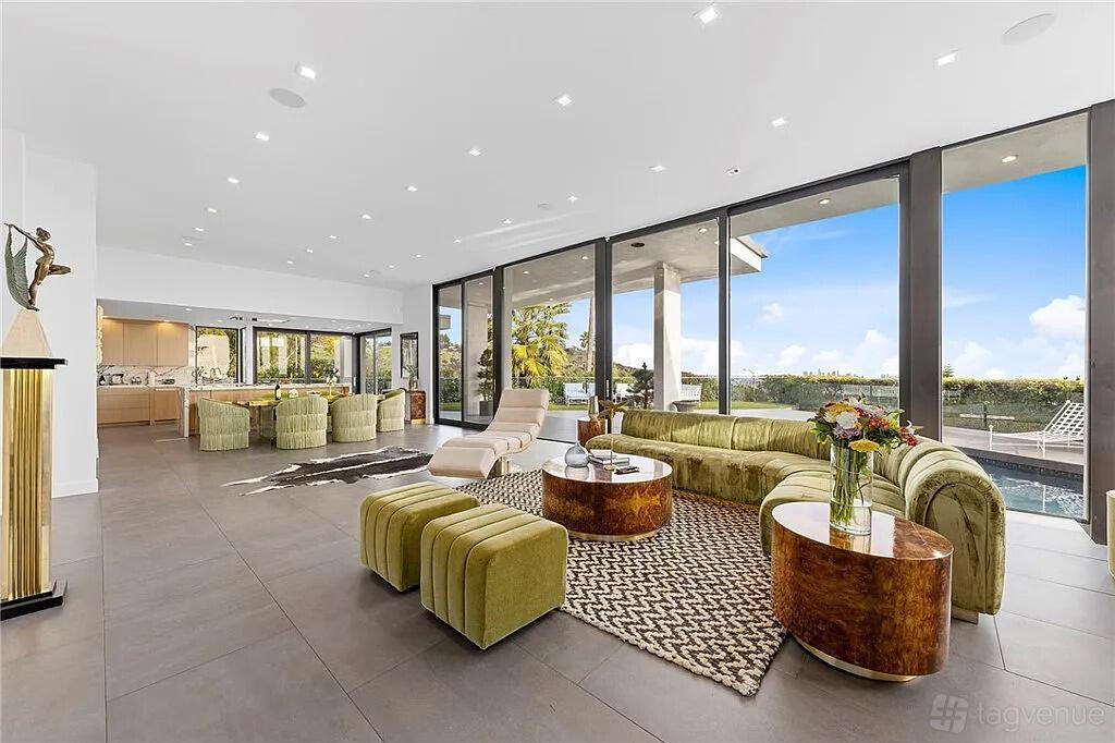 An apartment with floor-to-ceiling windows, velvet seating, and a private pool at Beautiful Villa with Downtown Views.