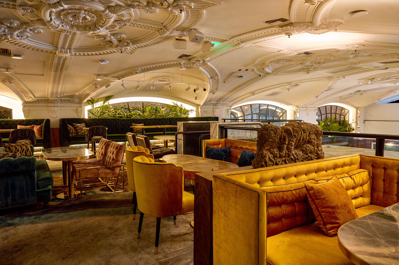 An event space with ornate vaulted ceilings, velvet banquettes, and marble tables at Zaya DTLA.