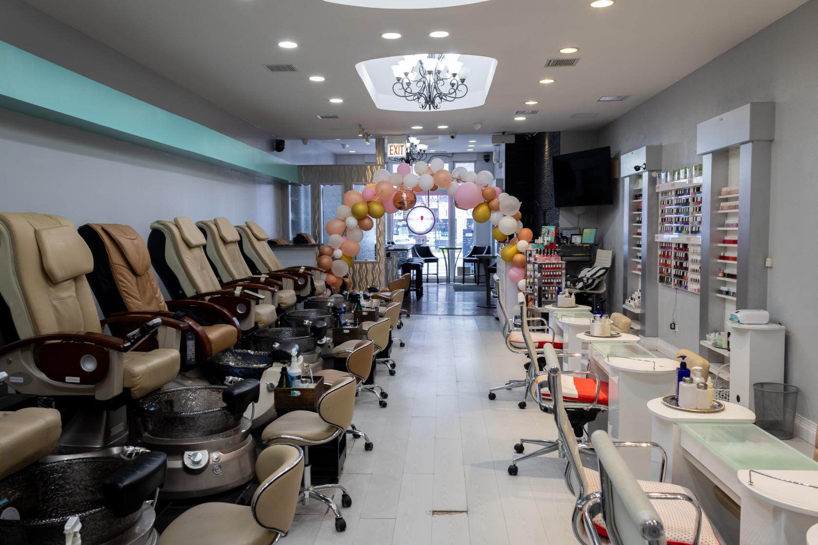 An event venue with pedicure chairs, manicure stations, and a balloon arch at 1244 N. Wells Events.