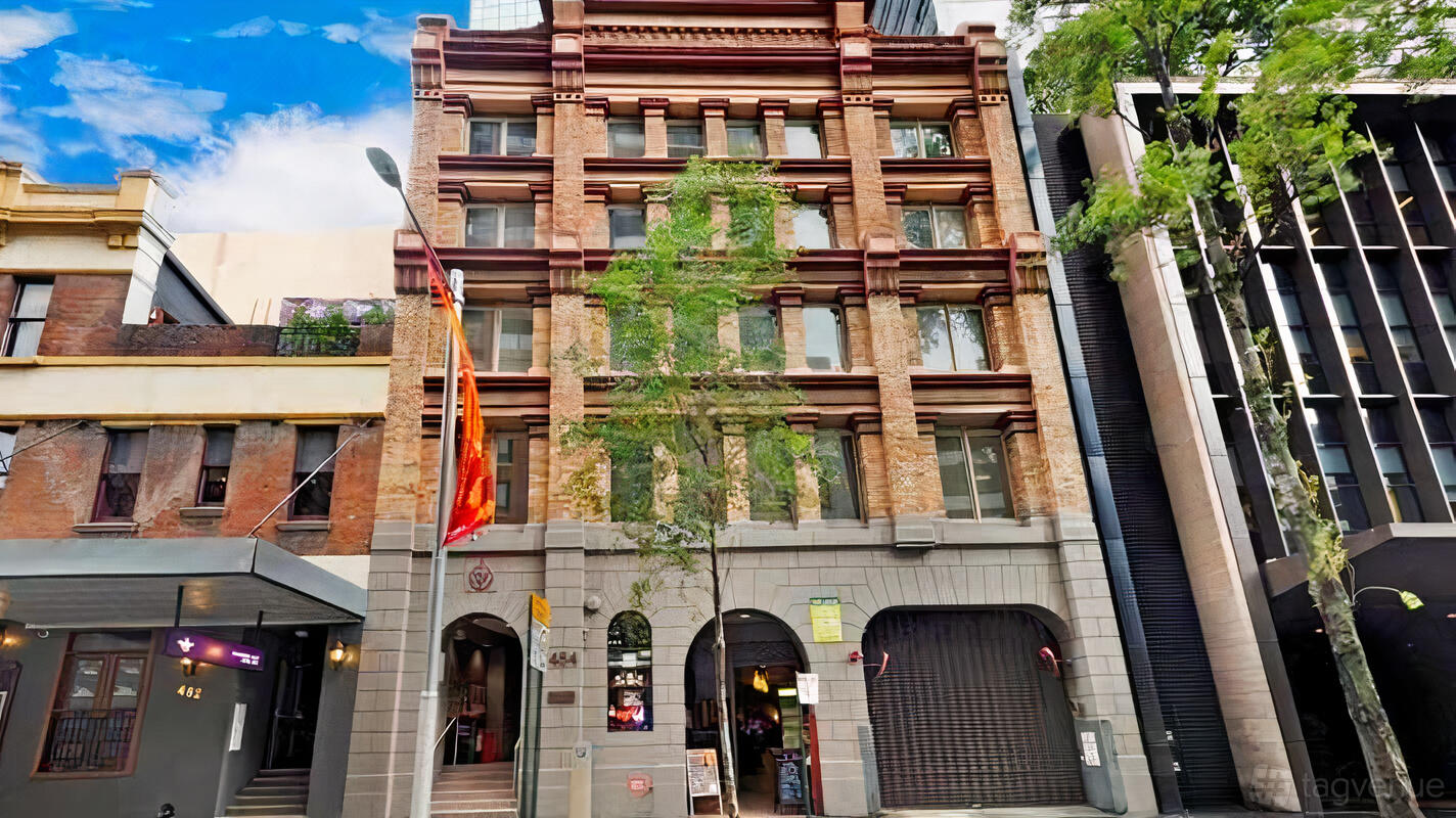 A versatile event space in a historic brick building with large windows and arched entry at Entermission Sydney.
