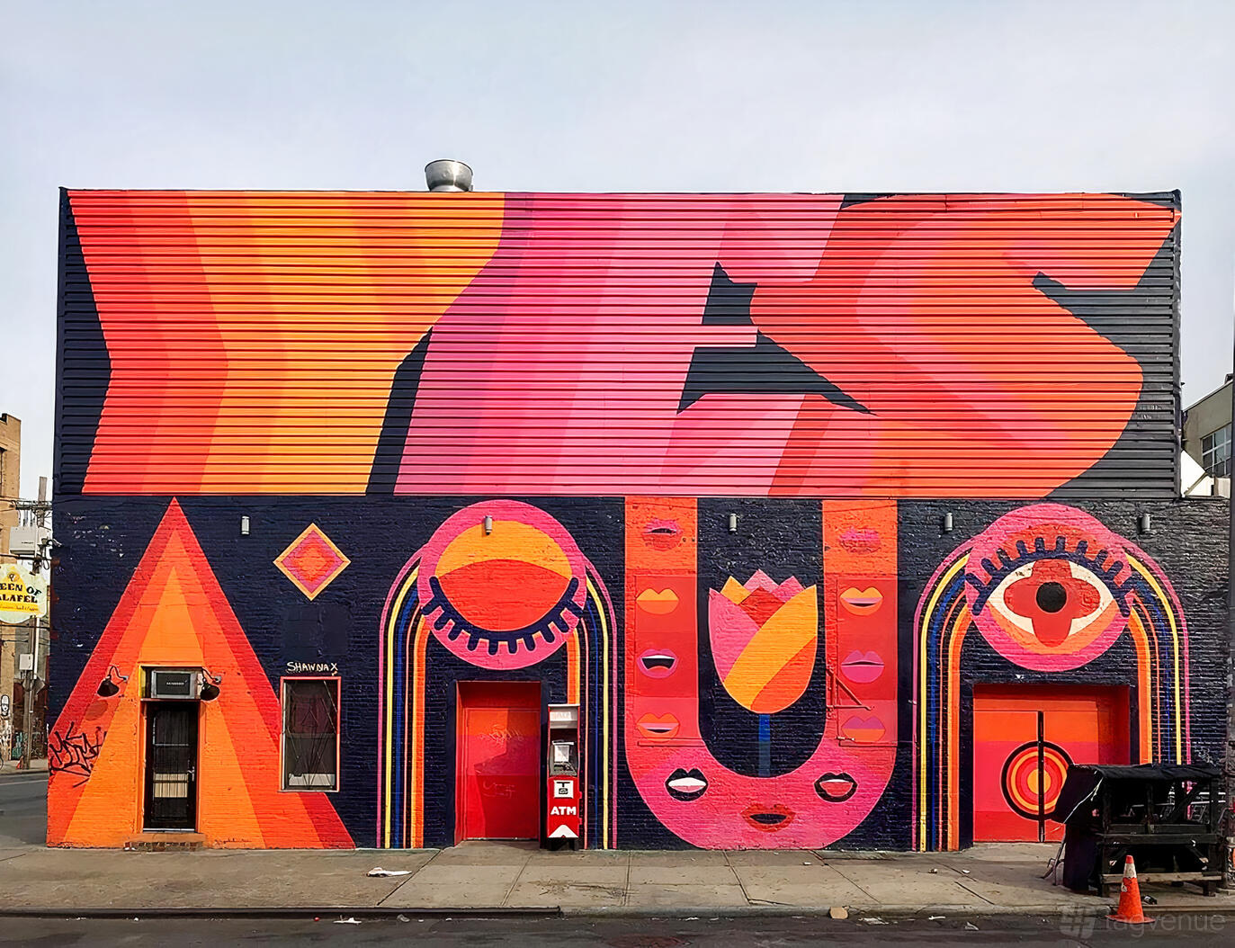 A nightclub with a colorful mural facade and bold geometric patterns at House of Yes.