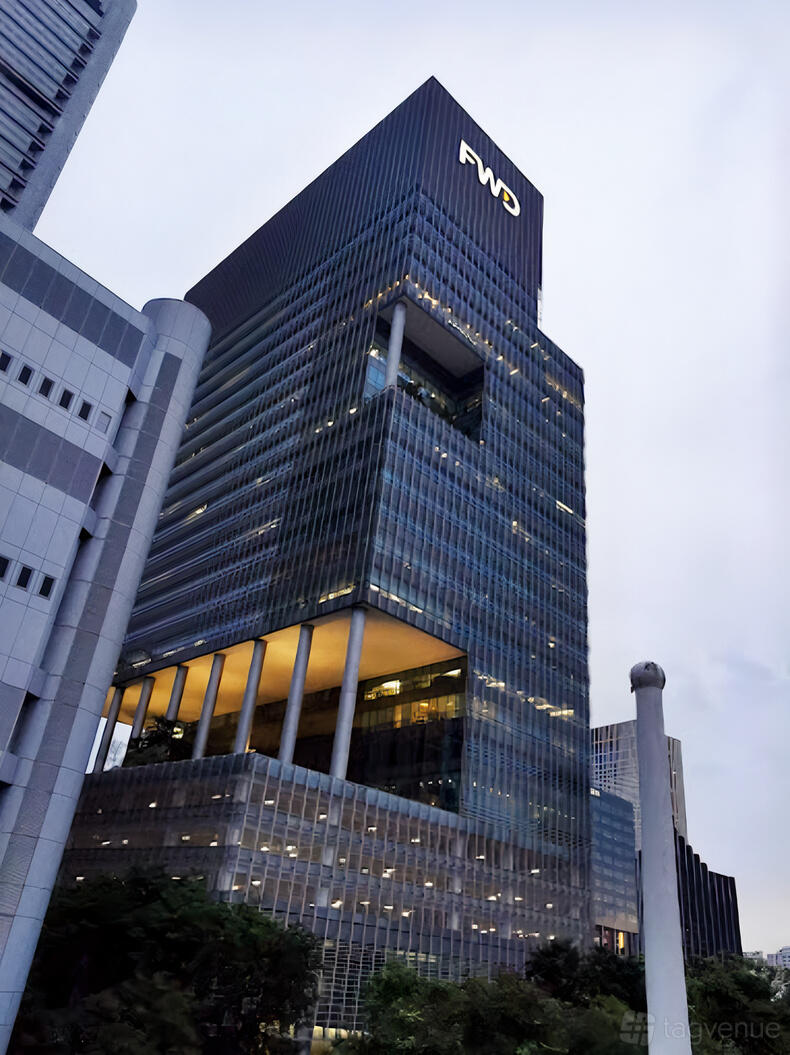A pub located in a high-rise tower with modern glass architecture and tall columns at Lady Wu.