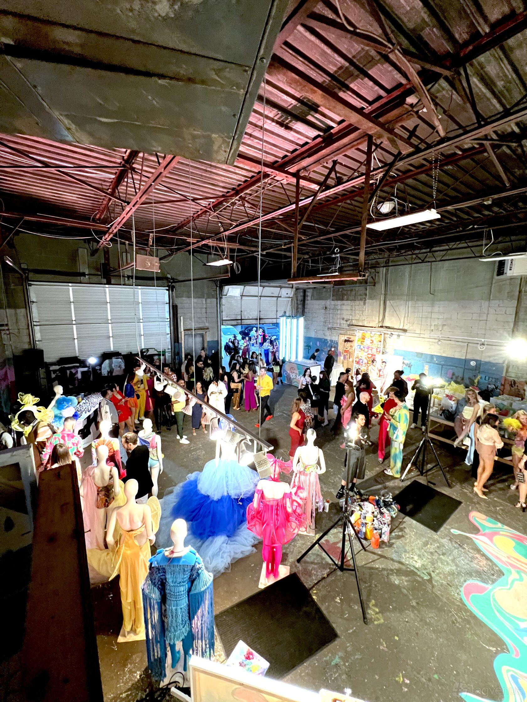 An event venue with exposed beams, high ceilings, and large garage doors at Industrial/high ceiling venue at 282 Geary.