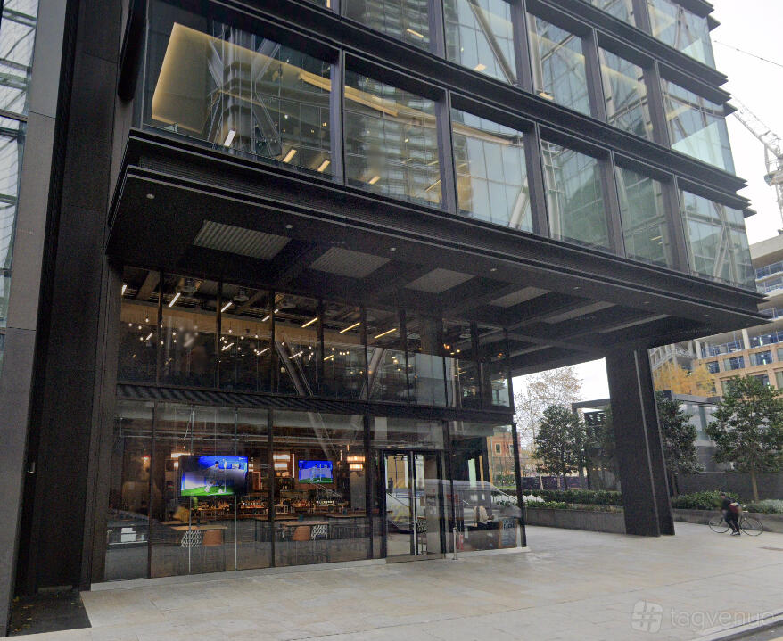 A bar with glass walls and visible seating area at the ground floor entrance of Beechwood.