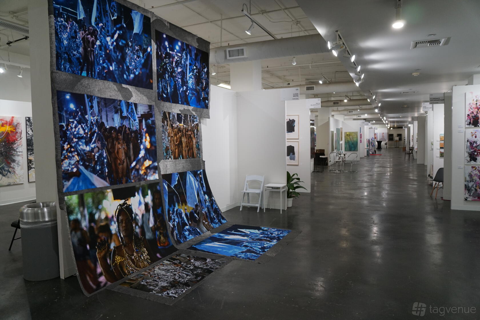 An event venue with polished concrete floors, gallery lighting, and large contemporary art displays at Magic Box LA.