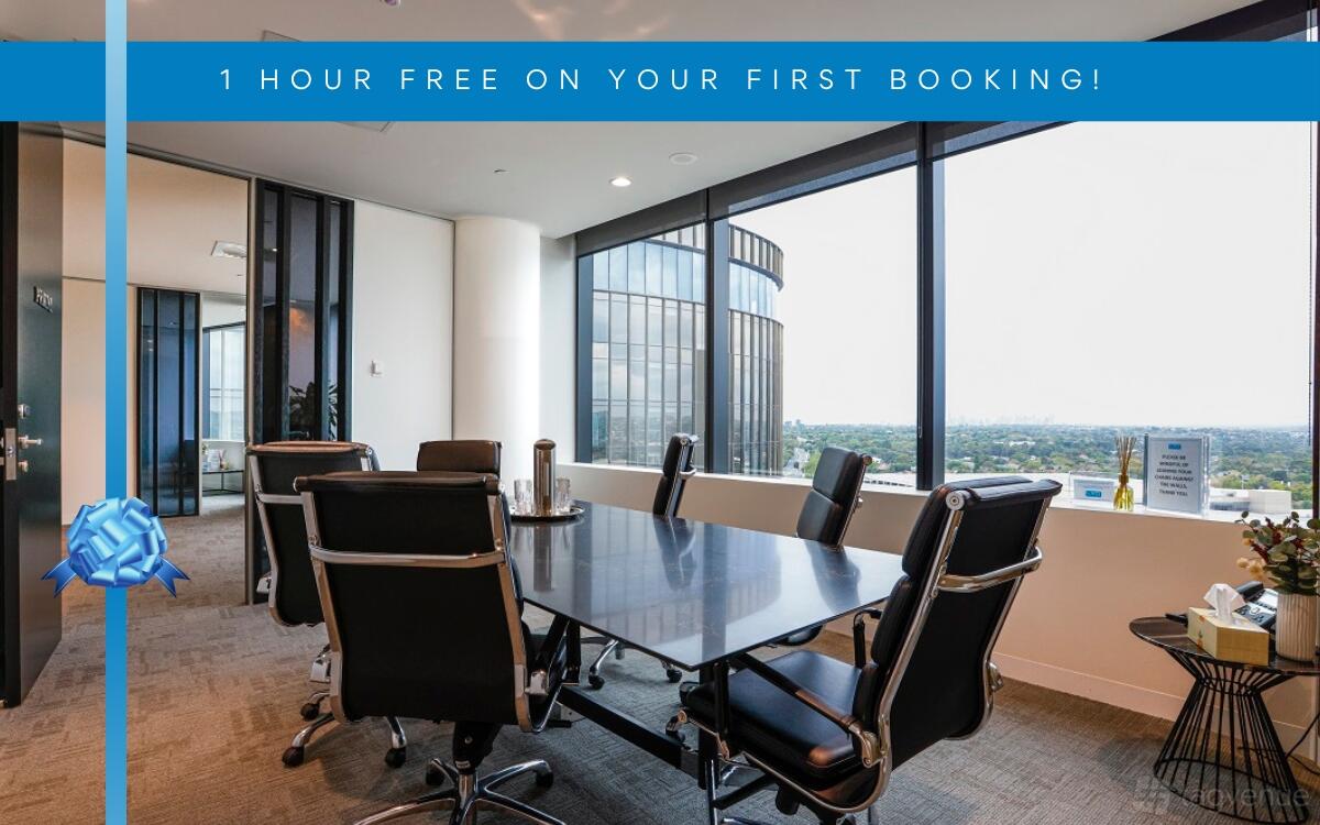 A meeting room with a glass-topped table, leather chairs, and floor-to-ceiling windows at LXD Business Centre Chadstone.