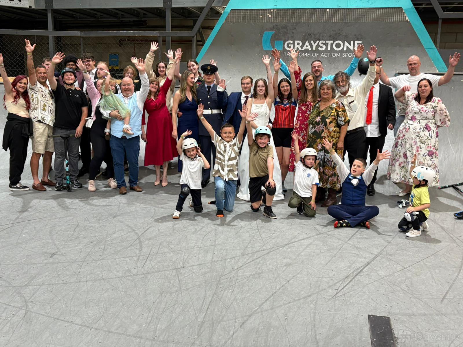 A group gathered on an indoor sports ramp beside a wall with Graystone branding at The View Bar and Restaurant.